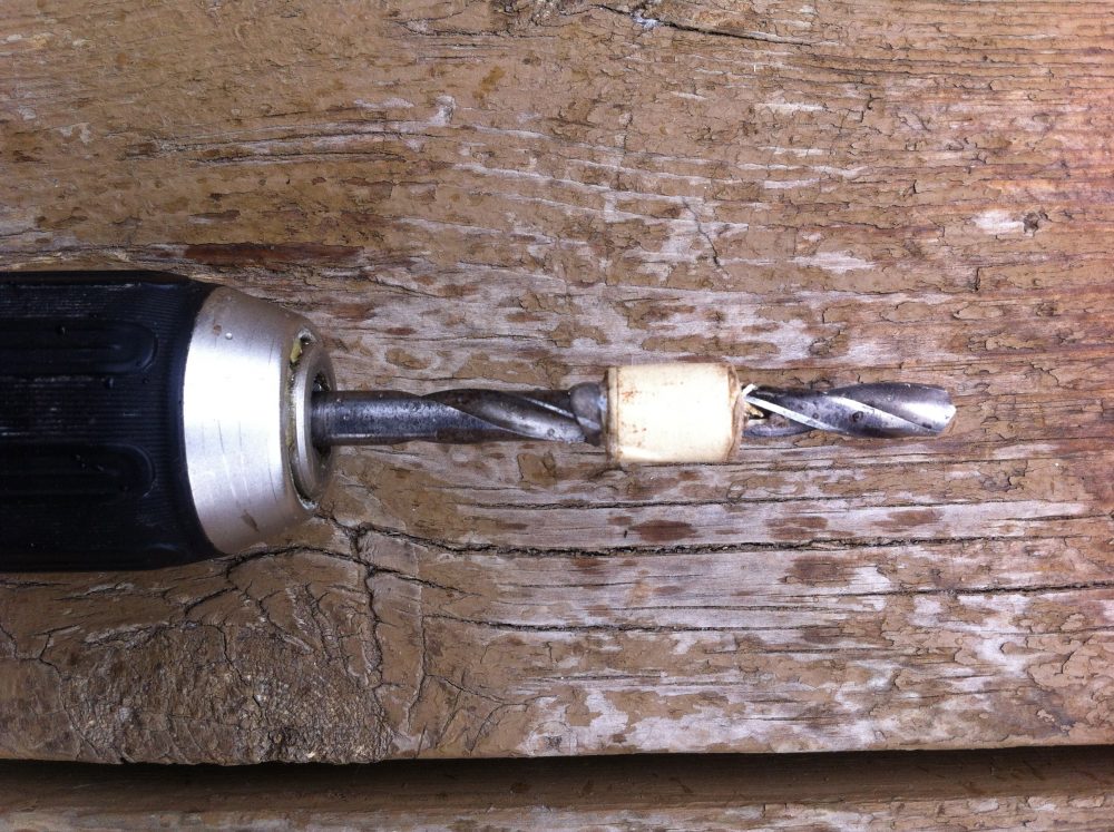 A portable drill with a 5/16" bit for plug spawn, slightly larger for sawdust spawn. The bit should have a stop at 1.25". this one is made of masking tape and hot glue.