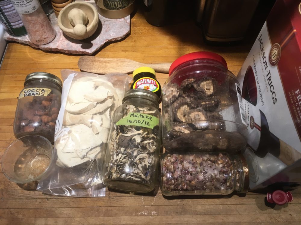dried shiitake, maitake, puffball, cocoa beans, garlic seeds(?) from mature scapes, salt and pepper